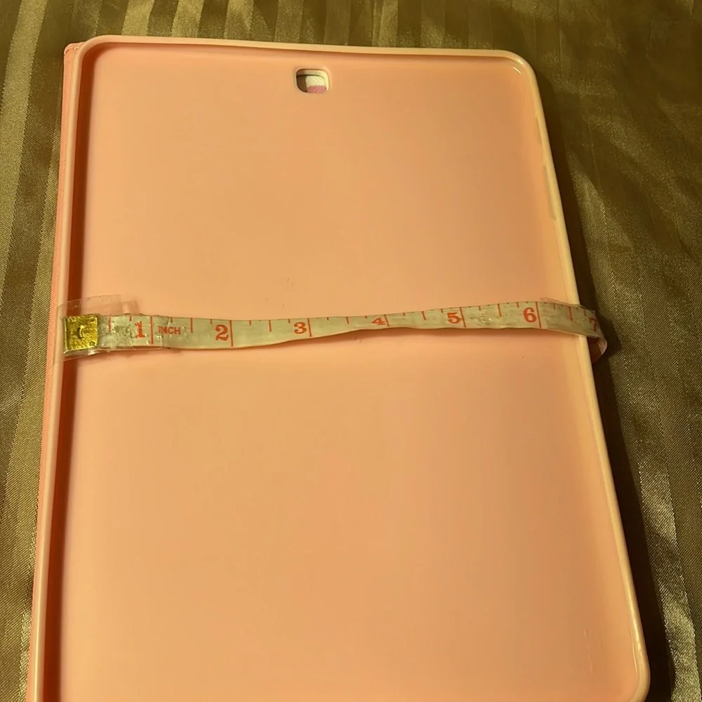 Floral pink colored tablet cover- not sure what type tablet fits in it.